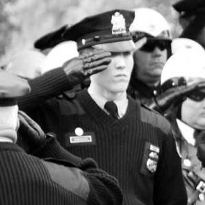 Philadelphia Police Officer James Robinson salutes the casket of fellow police officer Sgt. Simpson. Photo courtesy of James Robinson.