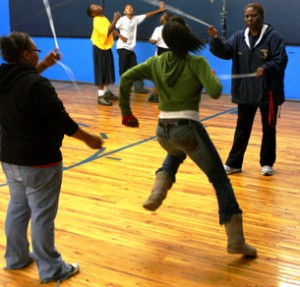 Officer Wells helps with some double dutch.