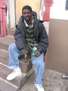 William Anderson Payne sits on a stoop.