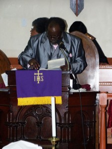 Reverend Davis addresses the congregation at Sunday service