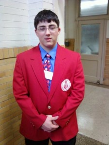 Elijah Resnick poses in his blazer at North Catholic. 